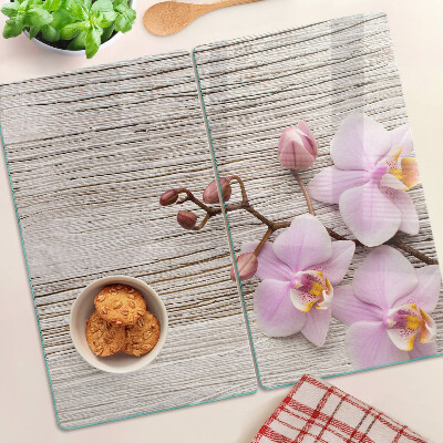 Skleněná krájecí deska Orchideje na dřevěném pozadí