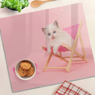 Skleněná deska do kuchyně Kotě na lehátku na růžovém pozadí