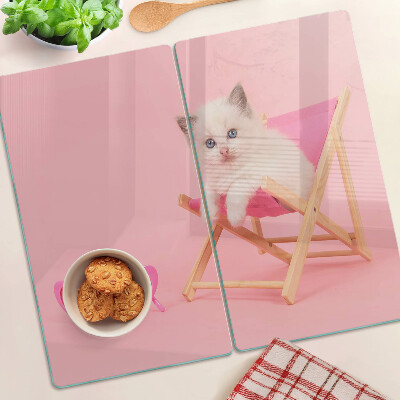Skleněná deska do kuchyně Kotě na lehátku na růžovém pozadí