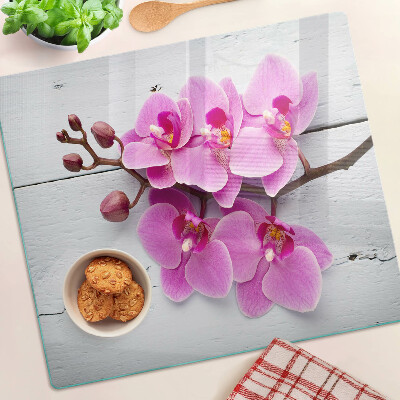 Skleněná deska do kuchyně Orchideje na bílém pozadí