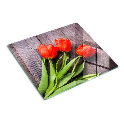 Skleněná krájecí deska Tulipány na dřevěném pozadí