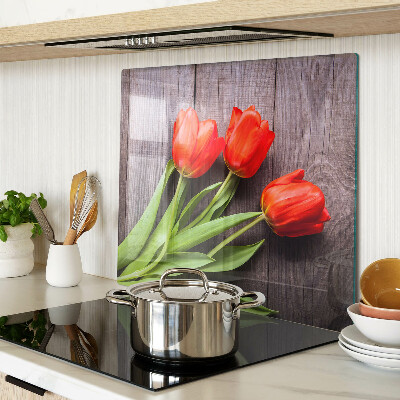 Skleněná krájecí deska Tulipány na dřevěném pozadí