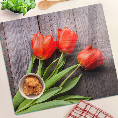 Skleněná krájecí deska Tulipány na dřevěném pozadí