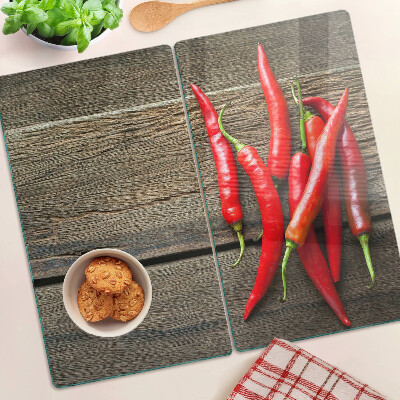 Skleněná krájecí deska Chilli papričky na dřevěném pozadí