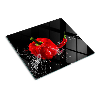 Skleněná deska do kuchyně Červená paprika ve vodě