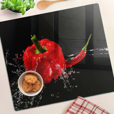 Skleněná deska do kuchyně Červená paprika ve vodě