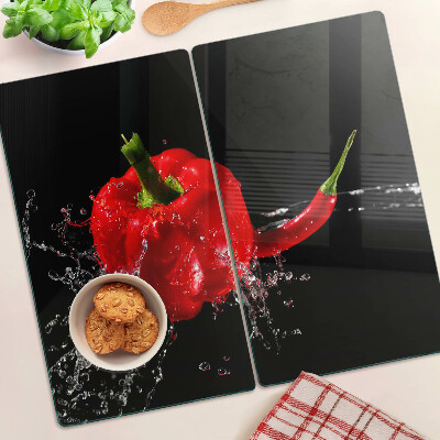Skleněná deska do kuchyně Červená paprika ve vodě
