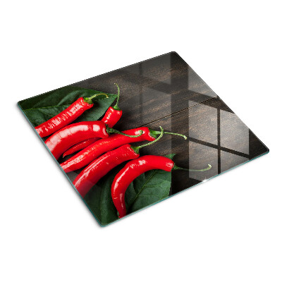 Skleněná deska do kuchyně Chilli papričky na dřevěném pozadí