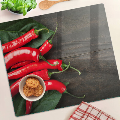 Skleněná deska do kuchyně Chilli papričky na dřevěném pozadí