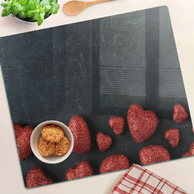 Krájecí prkénko skleněné Červená srdce na tmavém pozadí