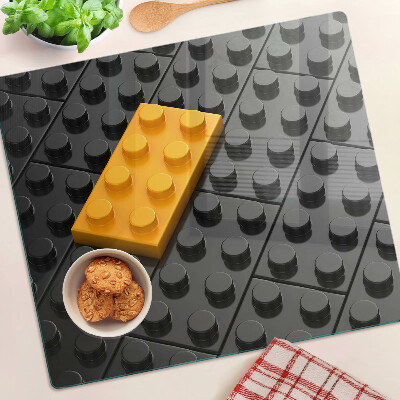 Skleněná deska do kuchyně LEGO kostky na černém pozadí