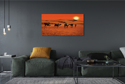 Obrazy na plátně Velbloudi lidí pouštní slunce nebe