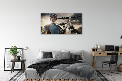 Obrazy na plátně Cyklista na kole mraky