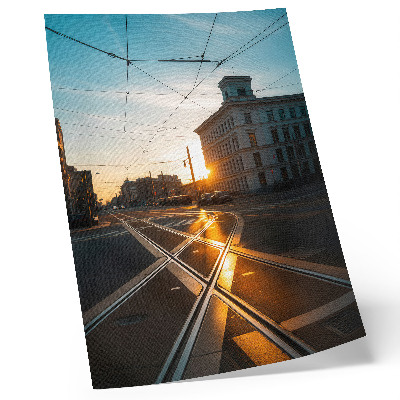 Nástěnný plakát Zapadající slunce nad městem s architekturou