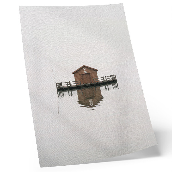 Plakátový obraz Dřevěná chata v minimalistickém stylu u vody