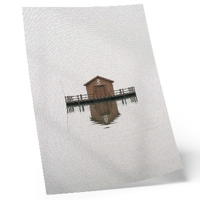 Plakátový obraz Dřevěná chata v minimalistickém stylu u vody
