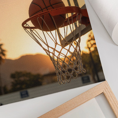 Dekorativní plakát Energický basketbalový míč při západu slunce