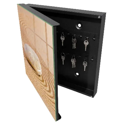 Skříňka na klíče v designu kámen na písku