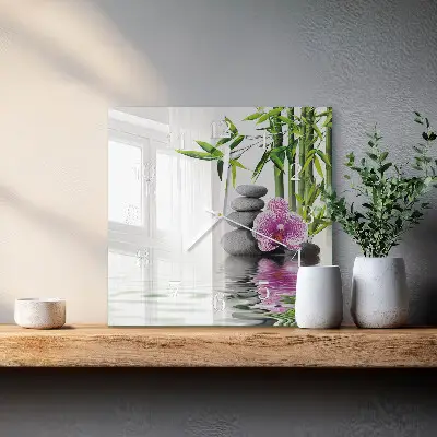 Čtvercové skleněné hodiny na zeď Kameny a orchidej